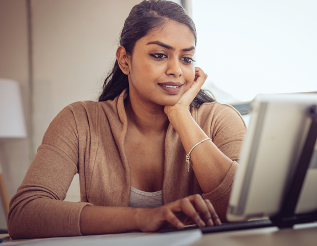 smiling woman computer revalidation.jpg